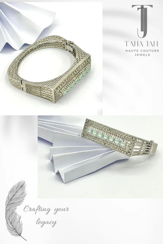Pure Silver Kara with Pastel Green Stone Inlays and Detailed Craftsmanship